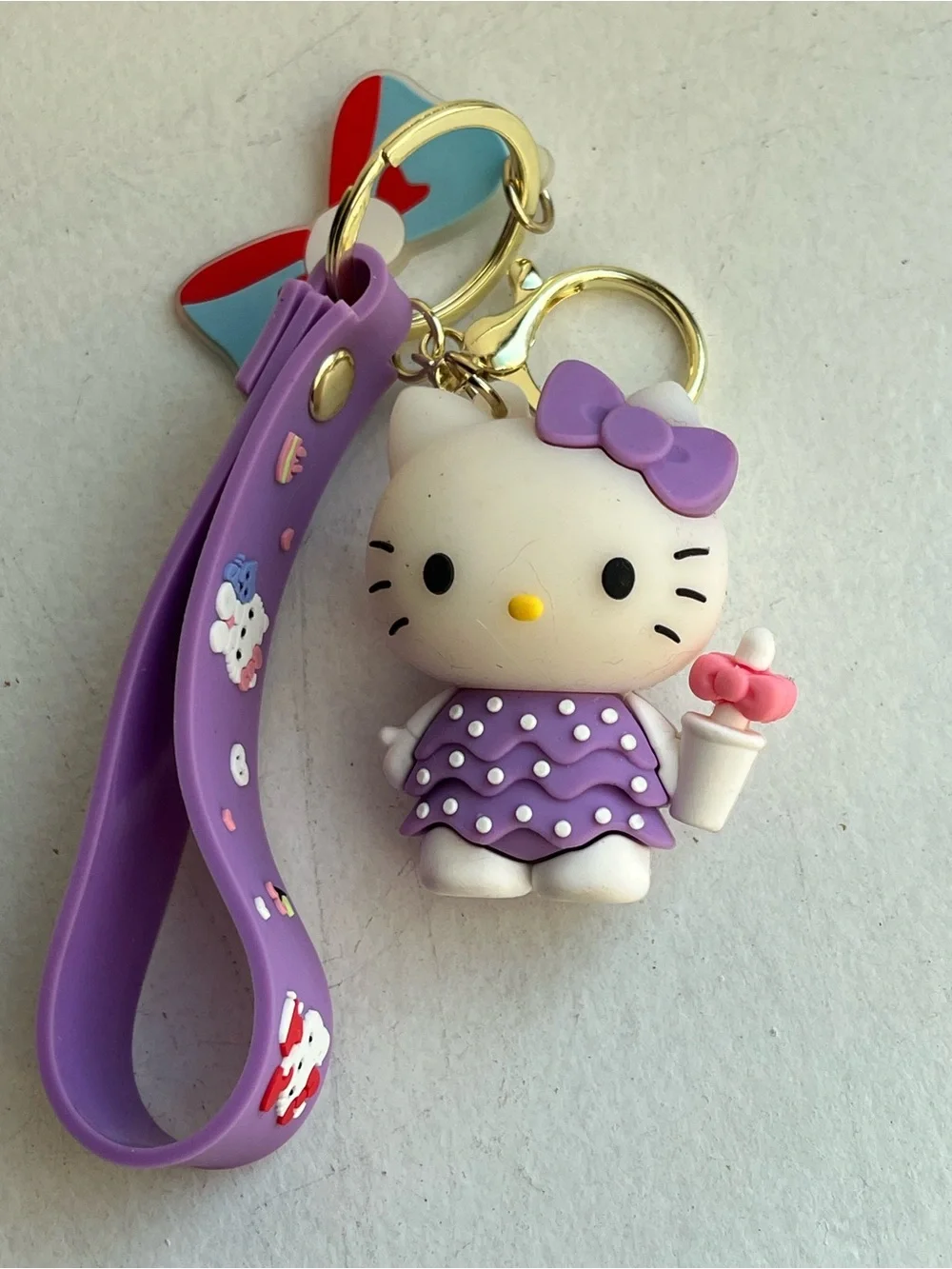 NWOT Hello Kitty Purple/Green  Bow Silicone Wrist Strap Keychain Charm